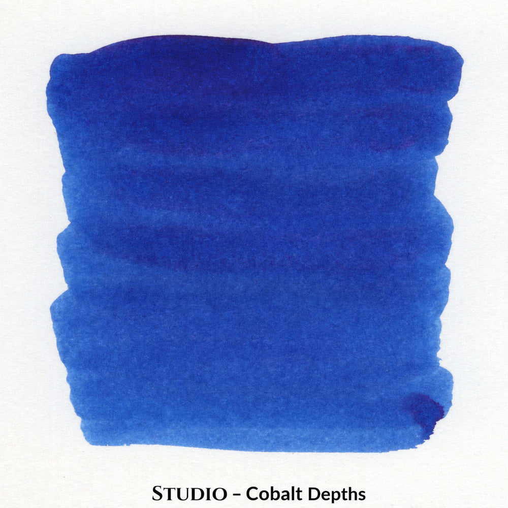 An ink swatch of deep cobalt blue ink on a white background, with the text 'Studio - Cobalt Depths' printed below.