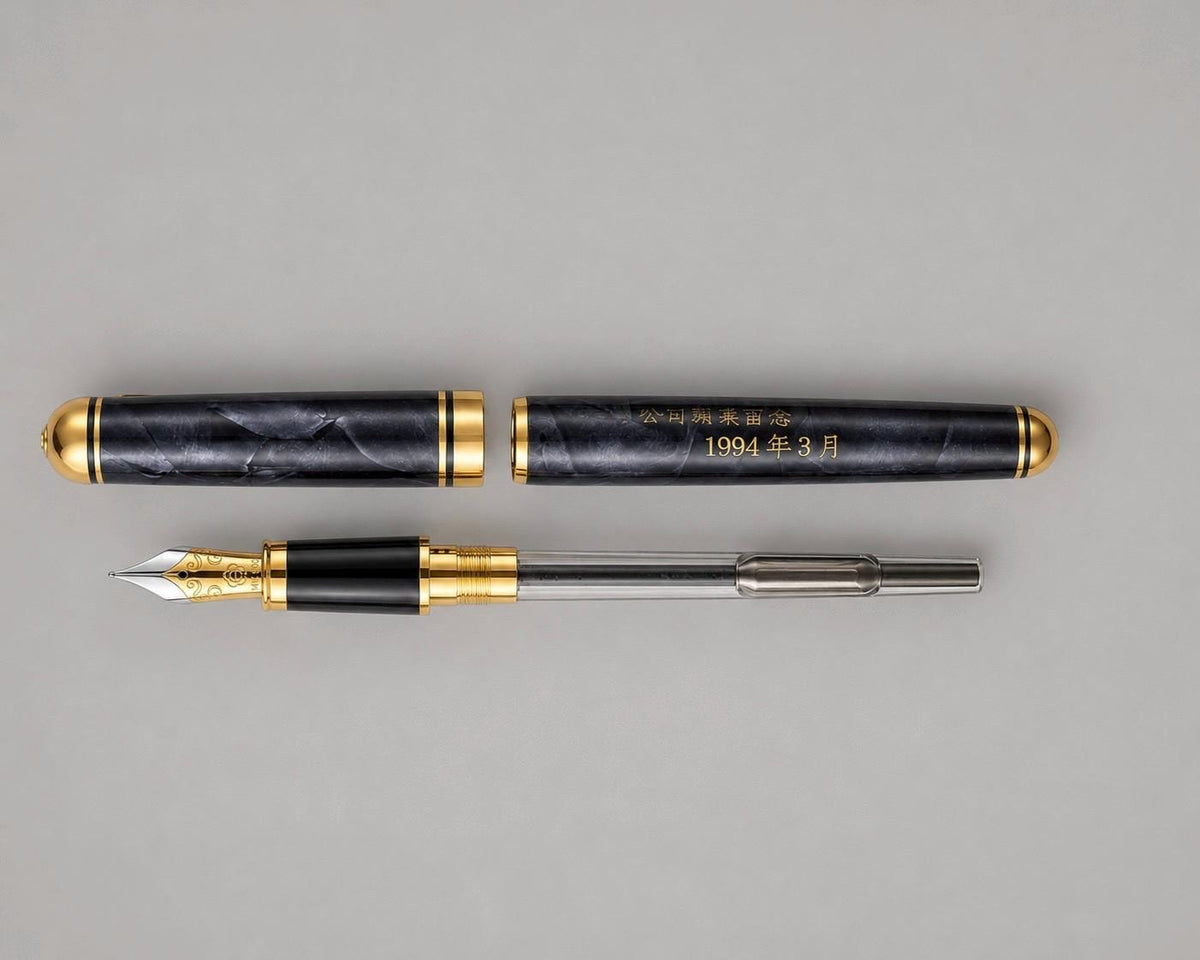 Hero Doctor vintage fountain pen shown uncapped with its grey acrylic cap and barrel